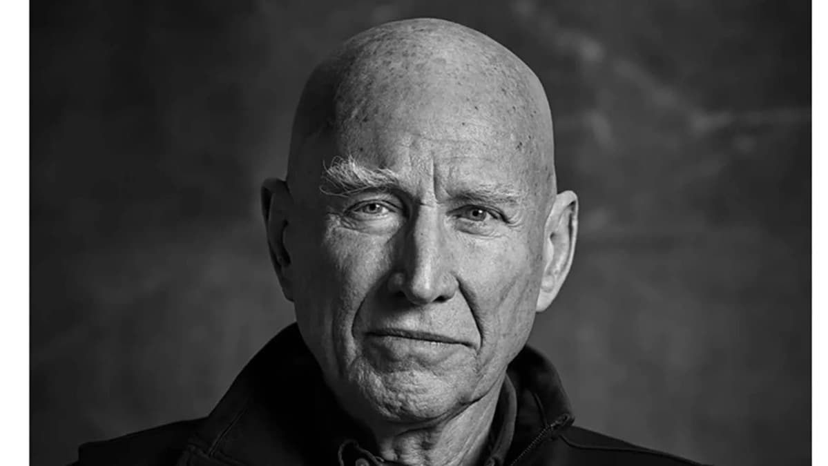 A black and white photo of an older man.